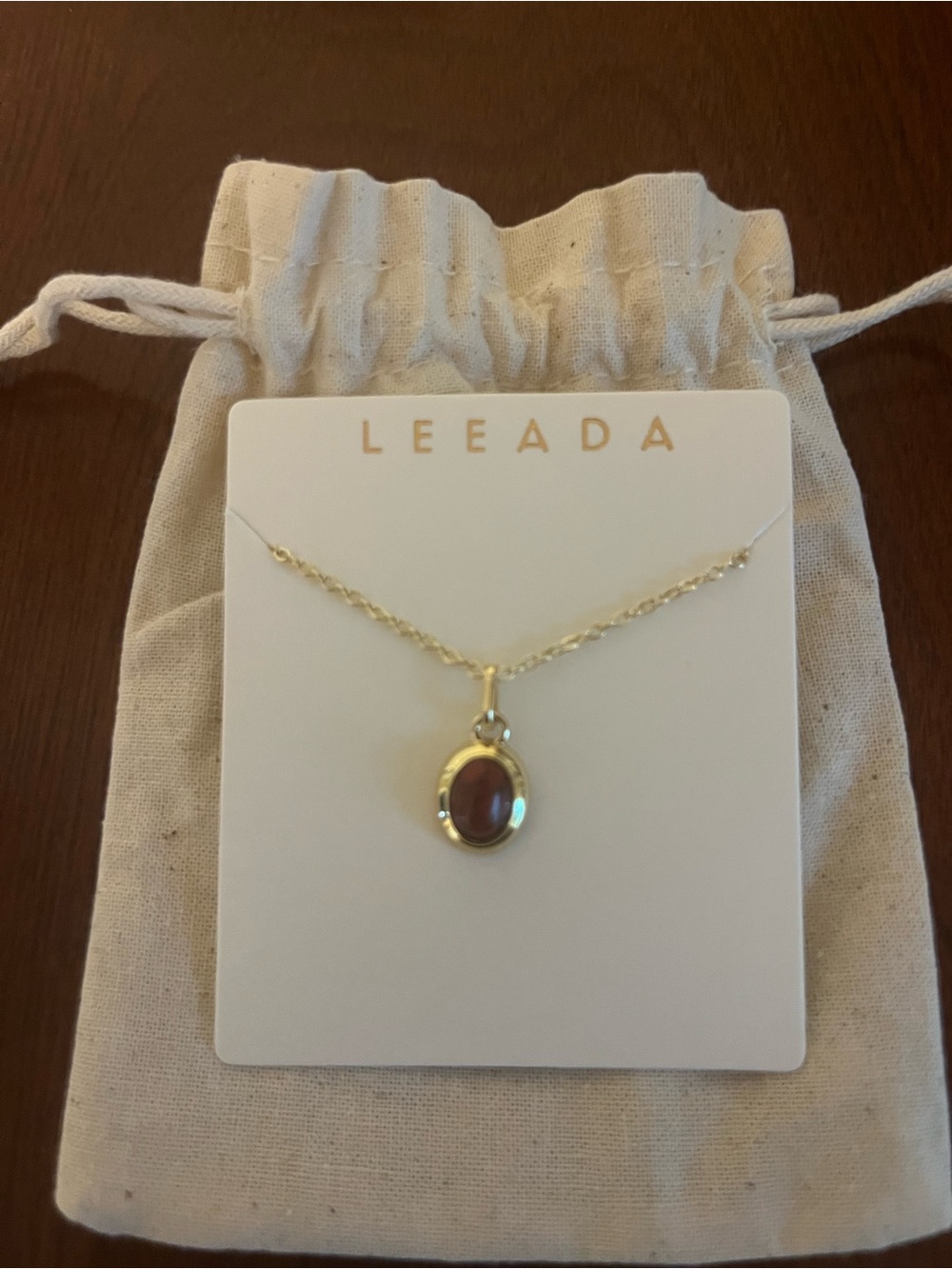 Gold Necklace with Burgundy Oval Gemstone Pendant